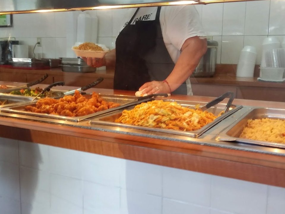 Menu board with Chinese fast food choices.
